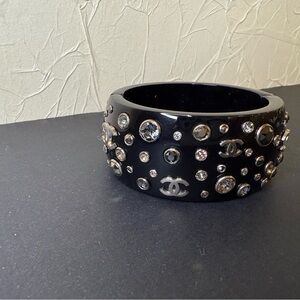 CHANEL Black Bangle with Crystal Accents. One stone missing( shown on photo).